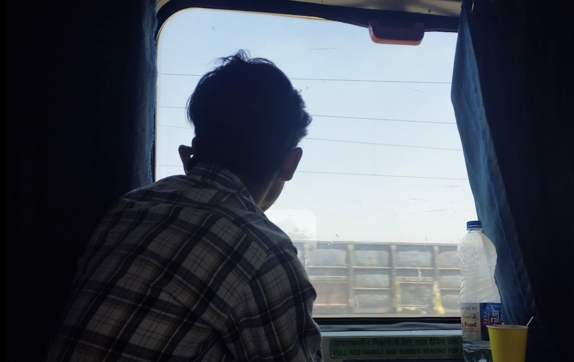 S.J. looking out the train window